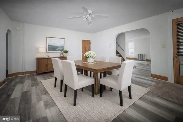a dining room with furniture and window