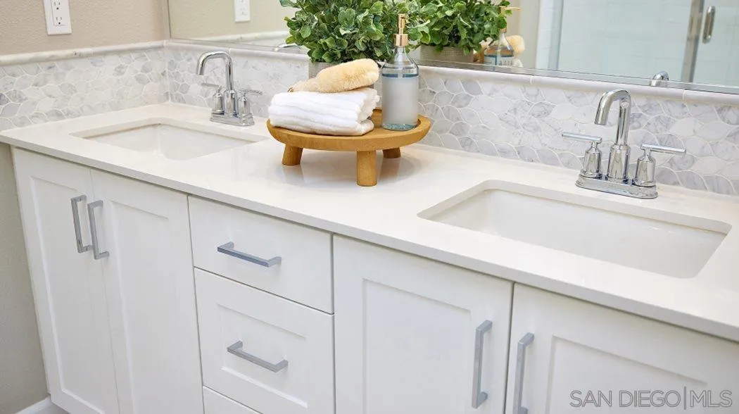 2139 Acara Circle San Diego, CA 92154 - Photo 10 of 10 a bathroom with a sink and a mirror