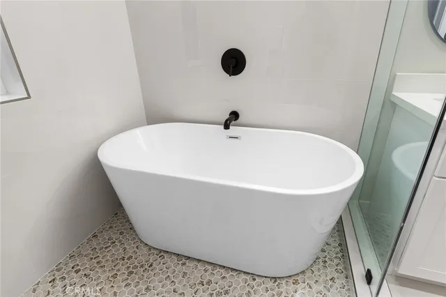 a white bath tub sitting in a bathroom