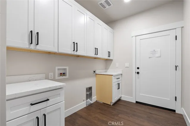 a view of cabinets and wooden floor