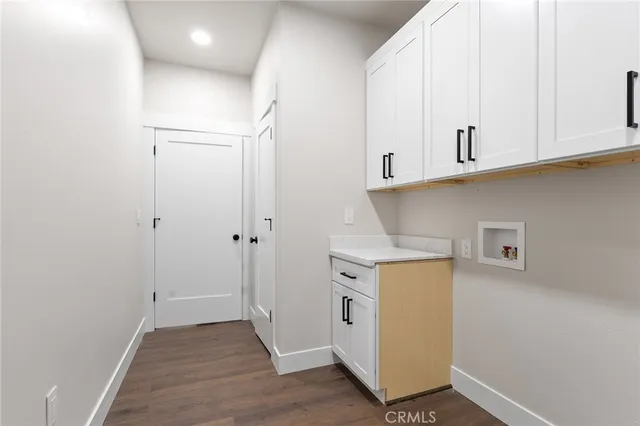 a view of cabinets and wooden floor