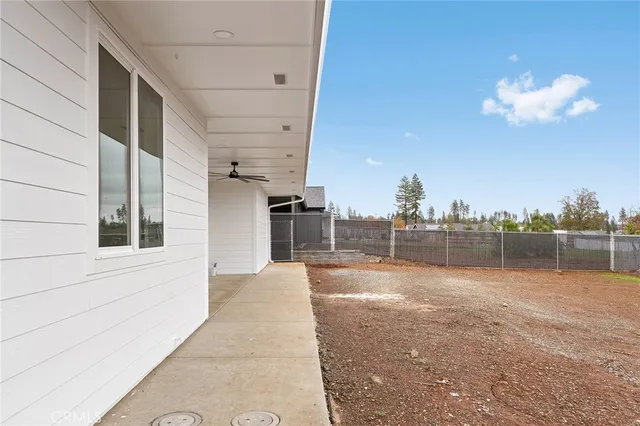 a view of a house with a yard and a garage