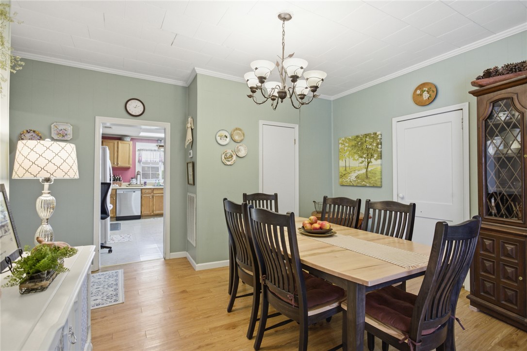 175 Burkett Road Seneca, SC 29672 - Photo 16 of 47 This inviting dining room offers a warm ambiance for gatherings, with a glimpse into the well-appointed kitchen.