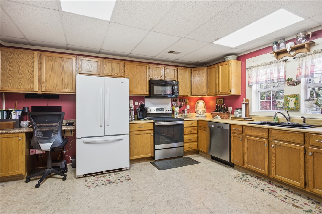 175 Burkett Road Seneca, SC 29672 - Photo 19 of 47 This spacious kitchen offers ample cabinetry, modern appliances, and a bright, functional layout perfect for daily living.