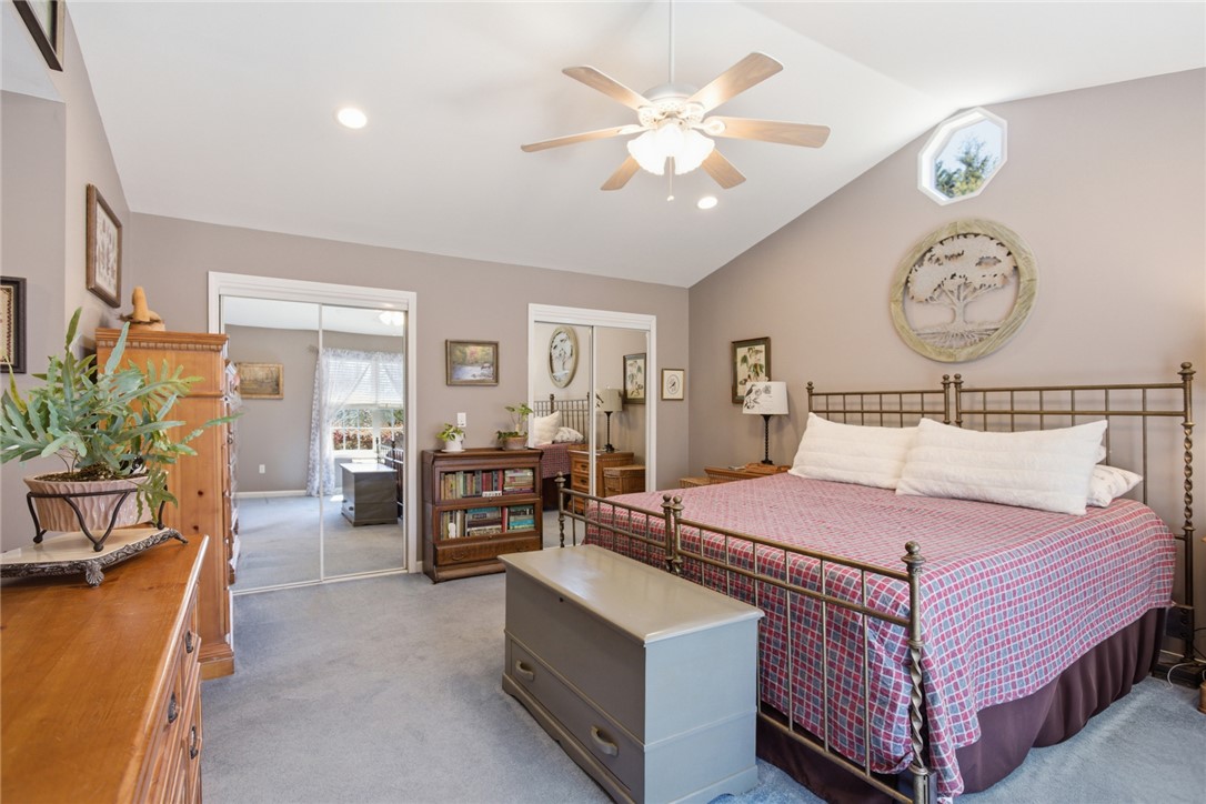 175 Burkett Road Seneca, SC 29672 - Photo 28 of 47 This spacious primary bedroom features vaulted ceilings and ample closet space, creating an airy and organized retreat.