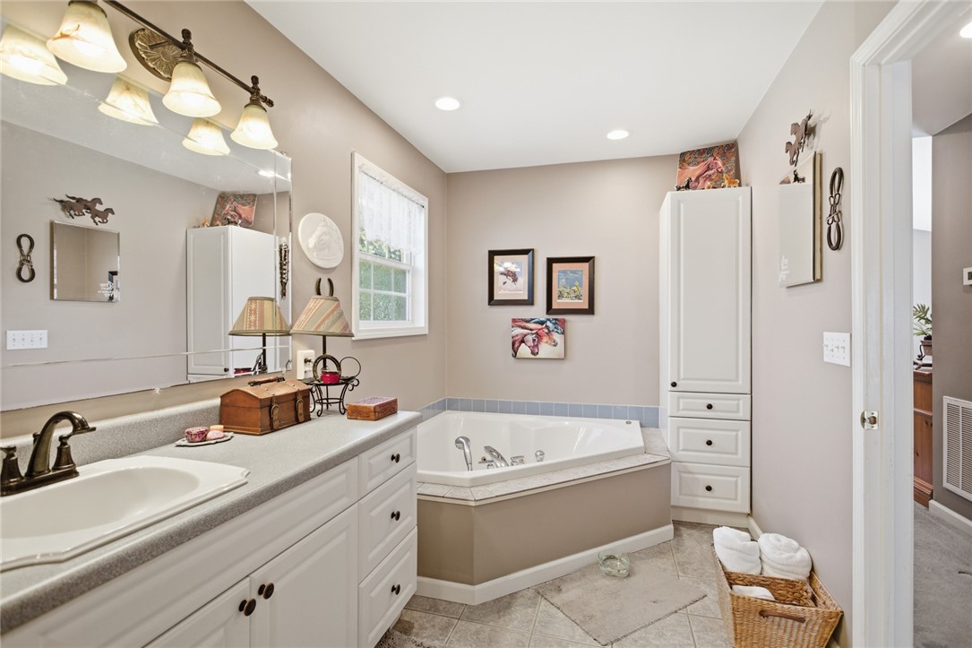 175 Burkett Road Seneca, SC 29672 - Photo 30 of 47 This serene bathroom offers a spacious vanity with ample storage, perfect for your daily routine.