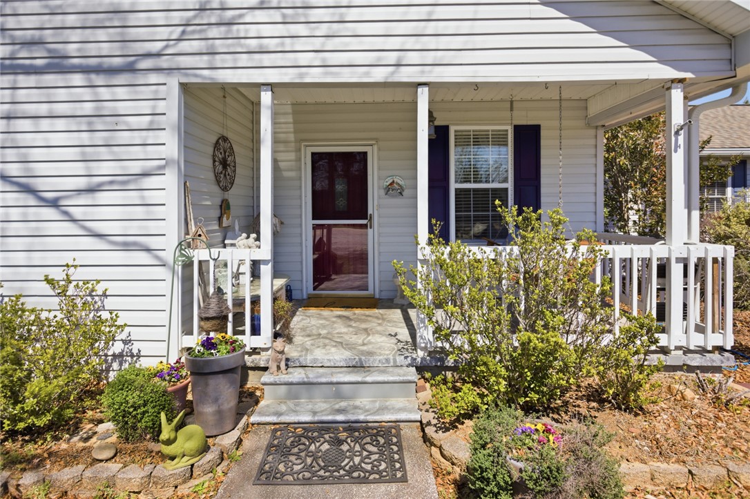 175 Burkett Road Seneca, SC 29672 - Photo 3 of 47 This charming front porch welcomes you with classic siding and well-maintained landscaping.