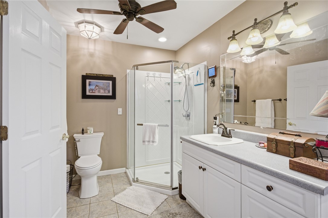 175 Burkett Road Seneca, SC 29672 - Photo 31 of 47 This bathroom features sleek white cabinetry and a convenient glass-enclosed shower.