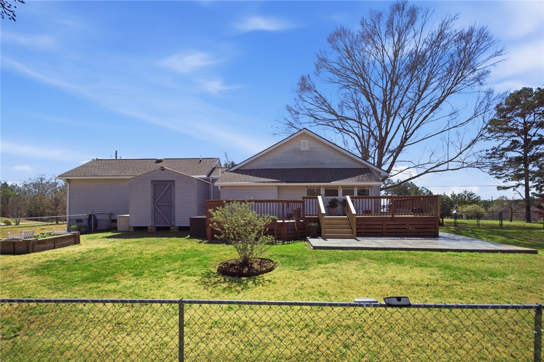 175 Burkett Road Seneca, SC 29672 - Photo 35 of 47 This spacious backyard features a versatile deck and a convenient shed.
