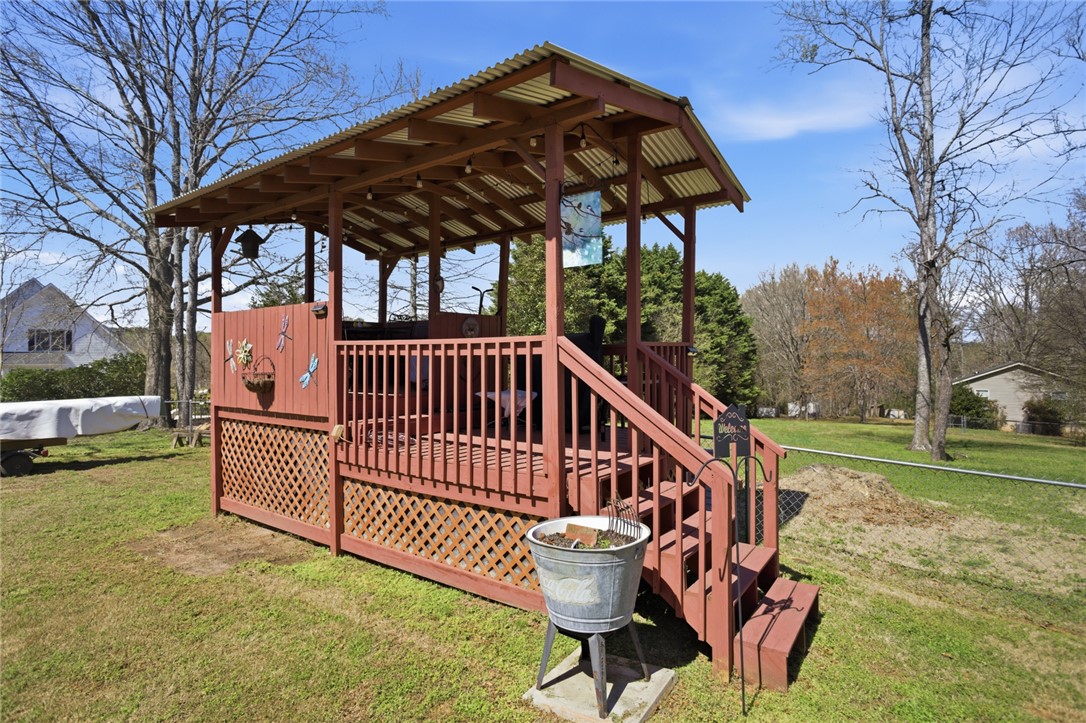 175 Burkett Road Seneca, SC 29672 - Photo 36 of 47 This charming outdoor playhouse offers a serene escape, perfect for enjoying quiet moments.