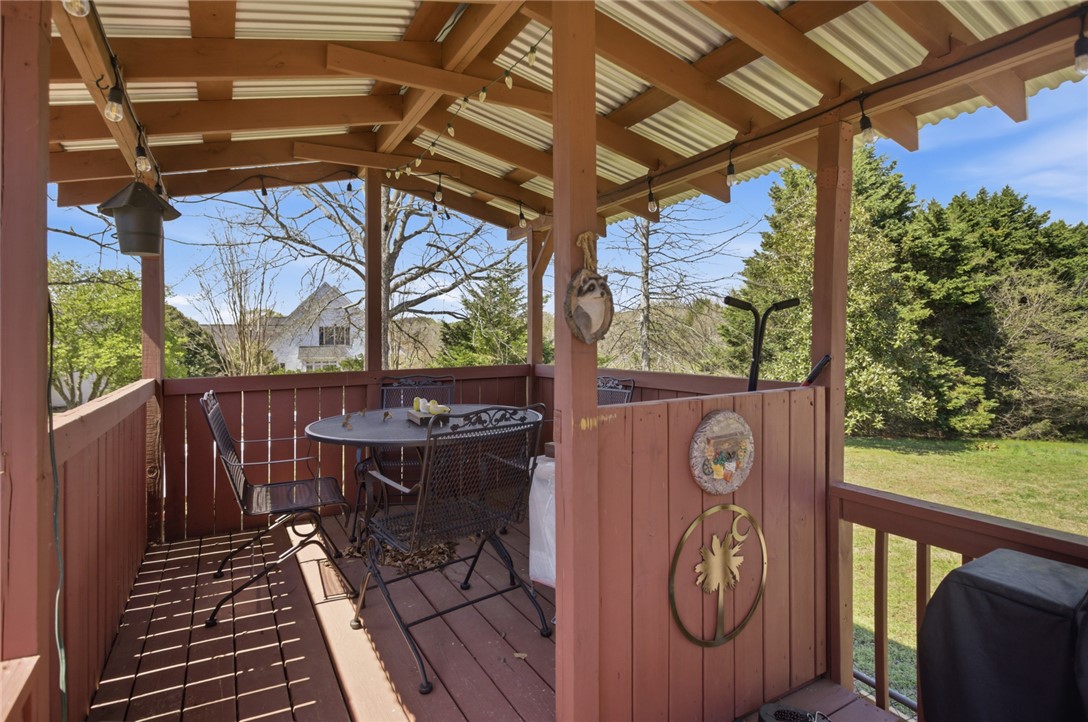 175 Burkett Road Seneca, SC 29672 - Photo 37 of 47 This recycled playhouse offers a comfortable space for outdoor enjoyment and serene views.