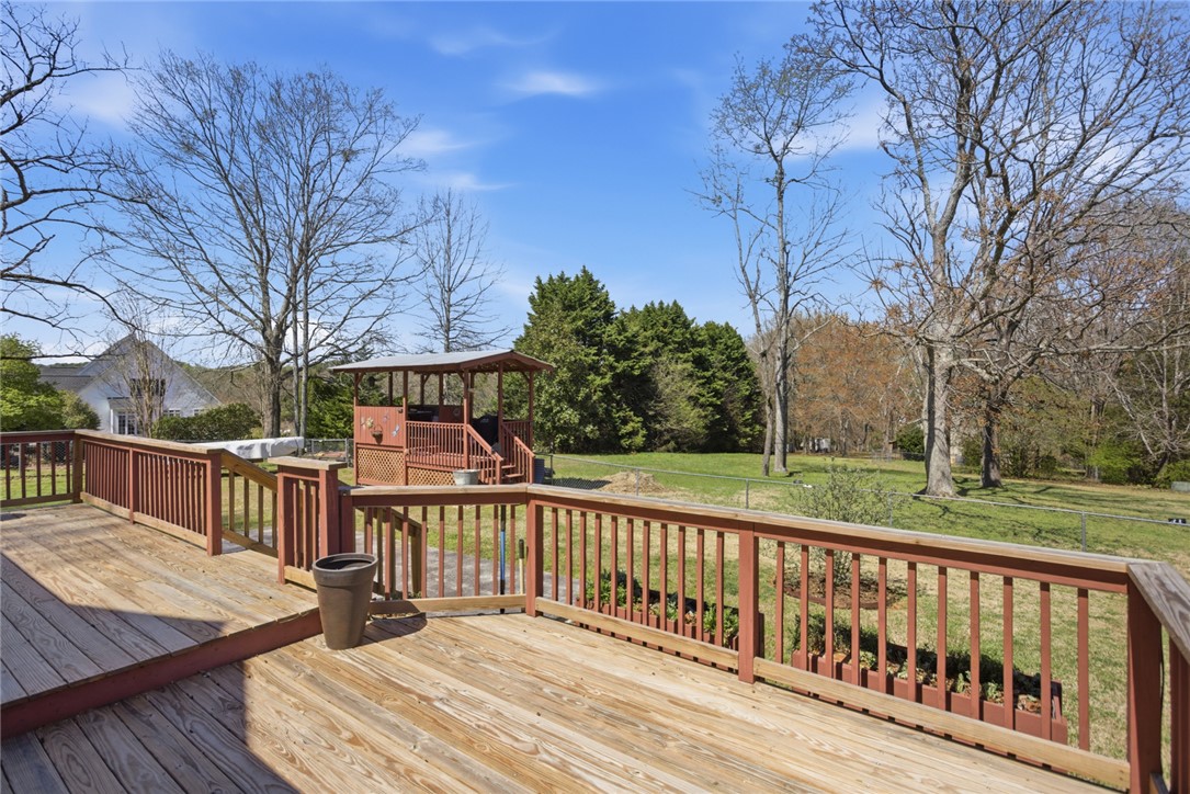 175 Burkett Road Seneca, SC 29672 - Photo 39 of 47 This spacious deck overlooks a serene backyard, perfect for outdoor entertaining.