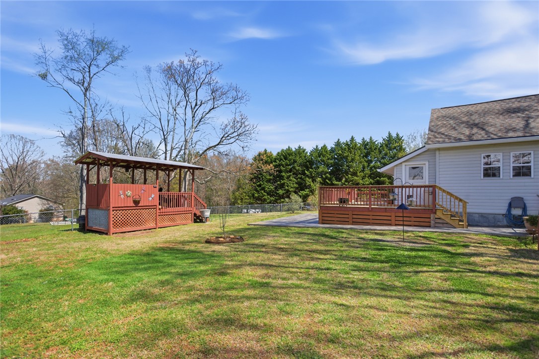 175 Burkett Road Seneca, SC 29672 - Photo 40 of 47 This expansive backyard offers ample space for outdoor living and recreation.