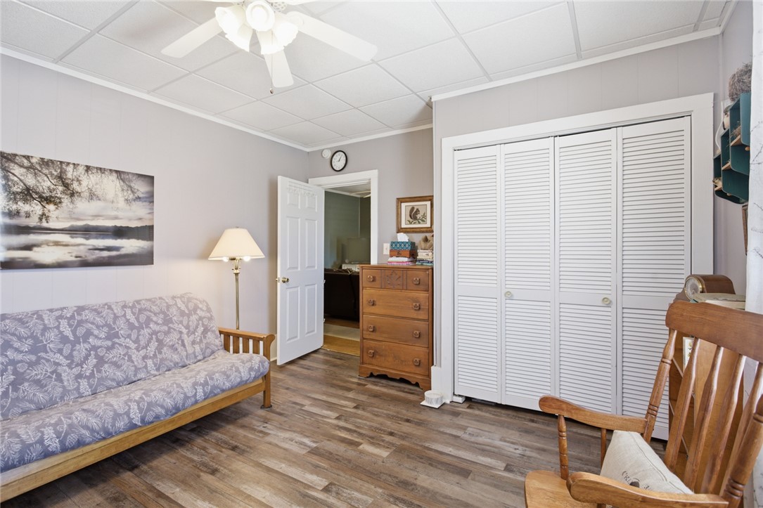 175 Burkett Road Seneca, SC 29672 - Photo 10 of 47 This inviting bedroom features plank flooring and a functional louvered closet.