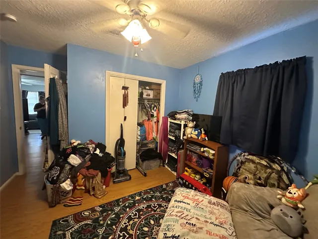 a bedroom with a bed and dresser