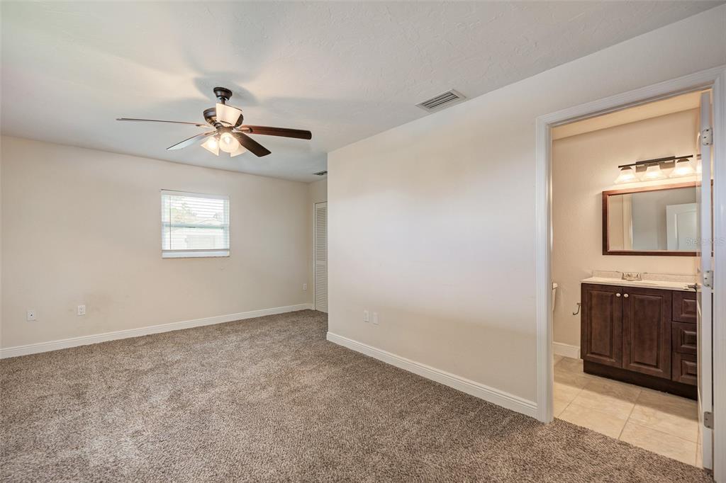 1330 Georgetowne Circle Sarasota, FL 34232 - Photo 27 of 46 an empty room with a bathroom and a window