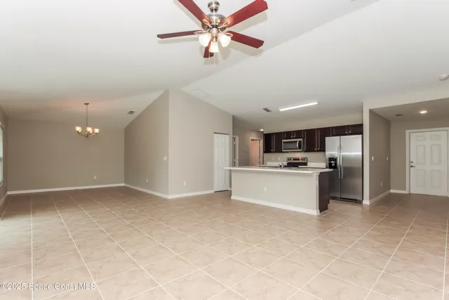 a view of kitchen with cabinets
