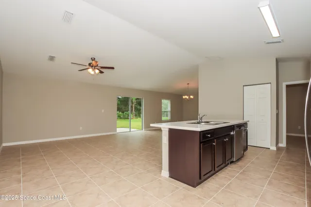 a view of a kitchen with a sink