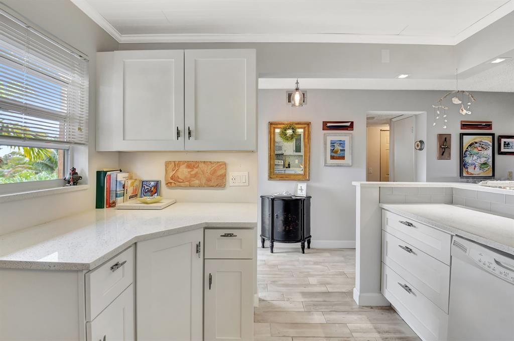 a kitchen with cabinets and window