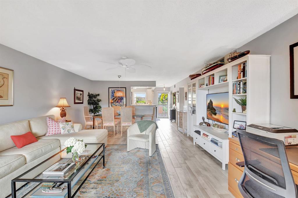 2615 Northeast 3rd Street, Unit 301 Boynton Beach, FL 33435 - Photo 12 of 67 a living room with furniture and a flat screen tv
