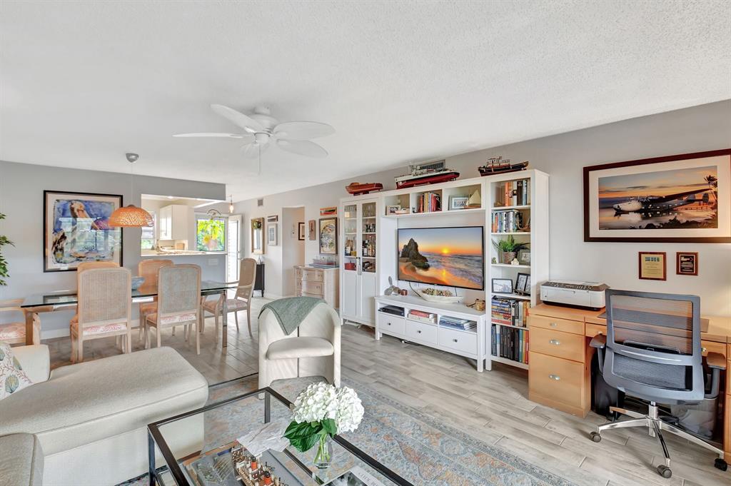2615 Northeast 3rd Street, Unit 301 Boynton Beach, FL 33435 - Photo 14 of 67 a living room with furniture and a flat screen tv