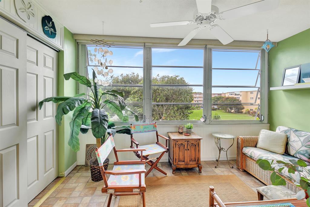 2615 Northeast 3rd Street, Unit 301 Boynton Beach, FL 33435 - Photo 15 of 67 a living room with furniture and a large window