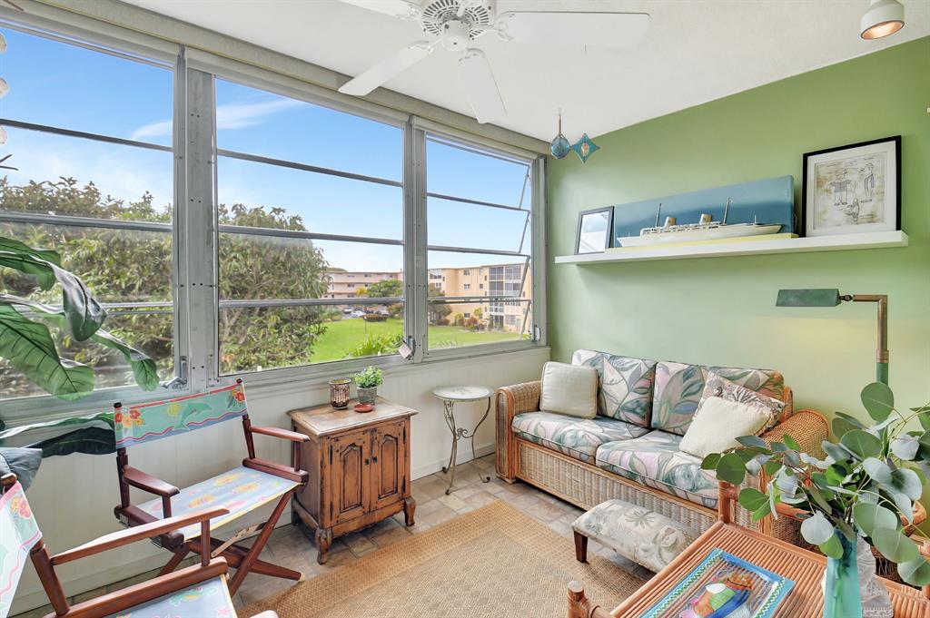 2615 Northeast 3rd Street, Unit 301 Boynton Beach, FL 33435 - Photo 18 of 67 a living room with furniture and a large window