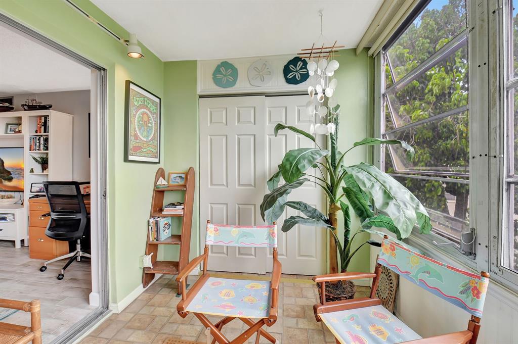 2615 Northeast 3rd Street, Unit 301 Boynton Beach, FL 33435 - Photo 19 of 67 a living room with furniture and a potted plant