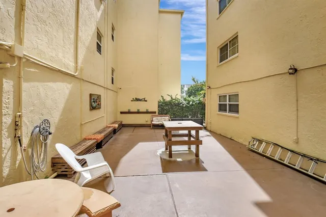 an aerial view of a house with yard swimming pool and outdoor seating