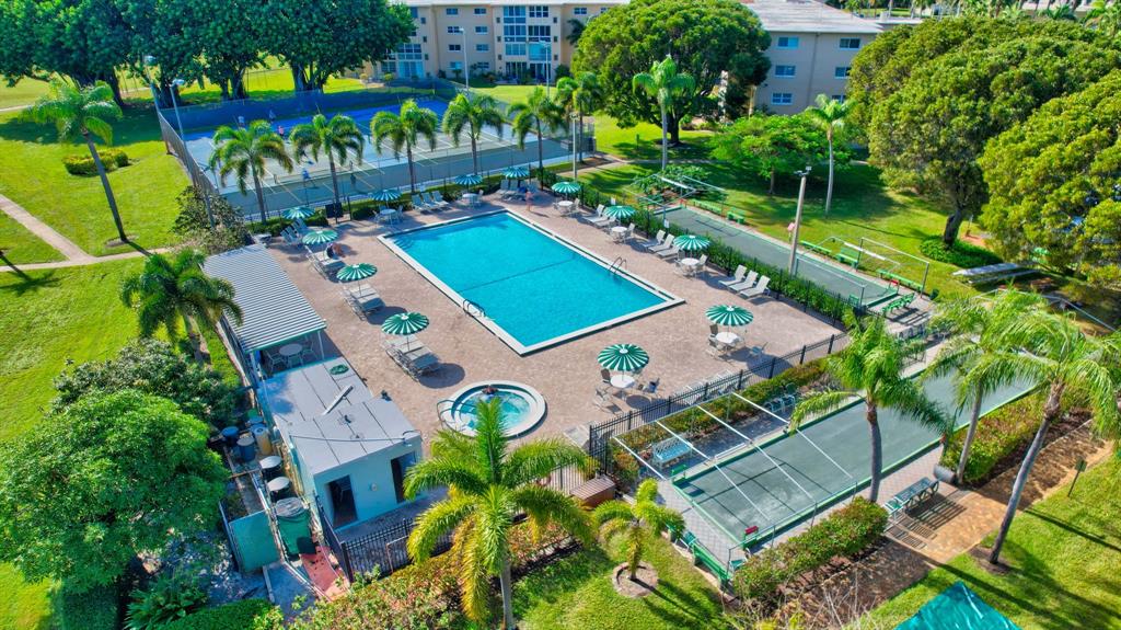 2615 Northeast 3rd Street, Unit 301 Boynton Beach, FL 33435 - Photo 40 of 67 aerial view of a chairs and table in a backyard