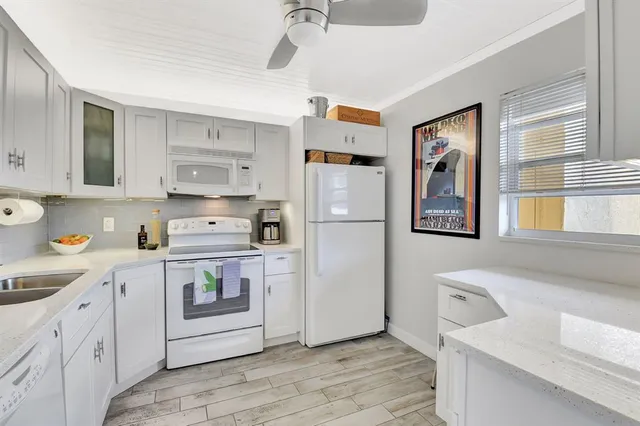 a living room with furniture a dining table and chairs