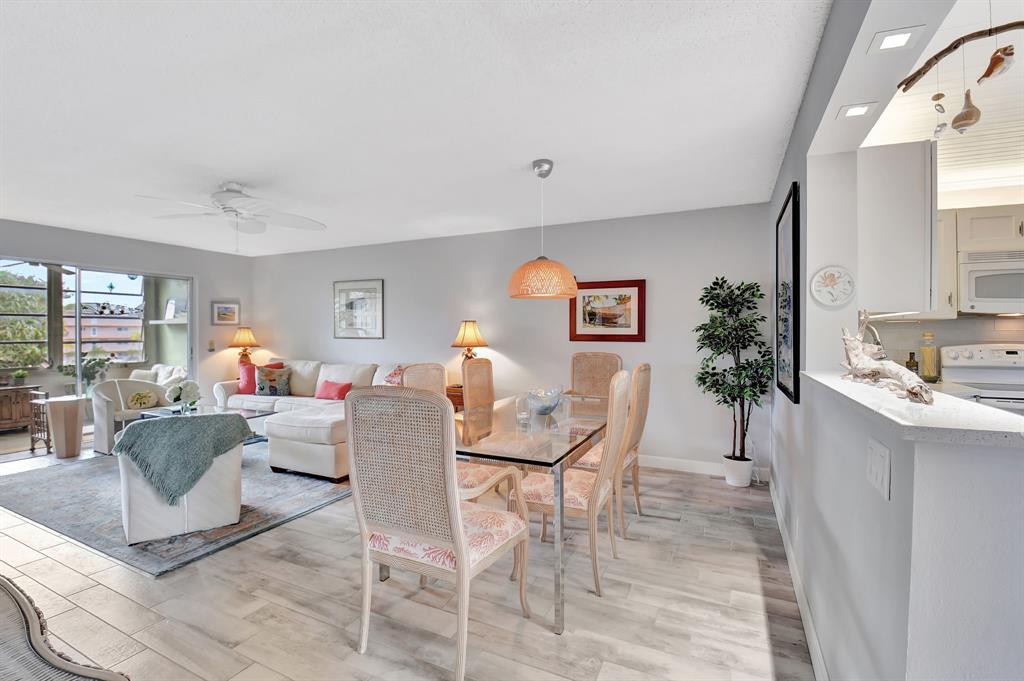 2615 Northeast 3rd Street, Unit 301 Boynton Beach, FL 33435 - Photo 8 of 67 a living room with furniture and a large window