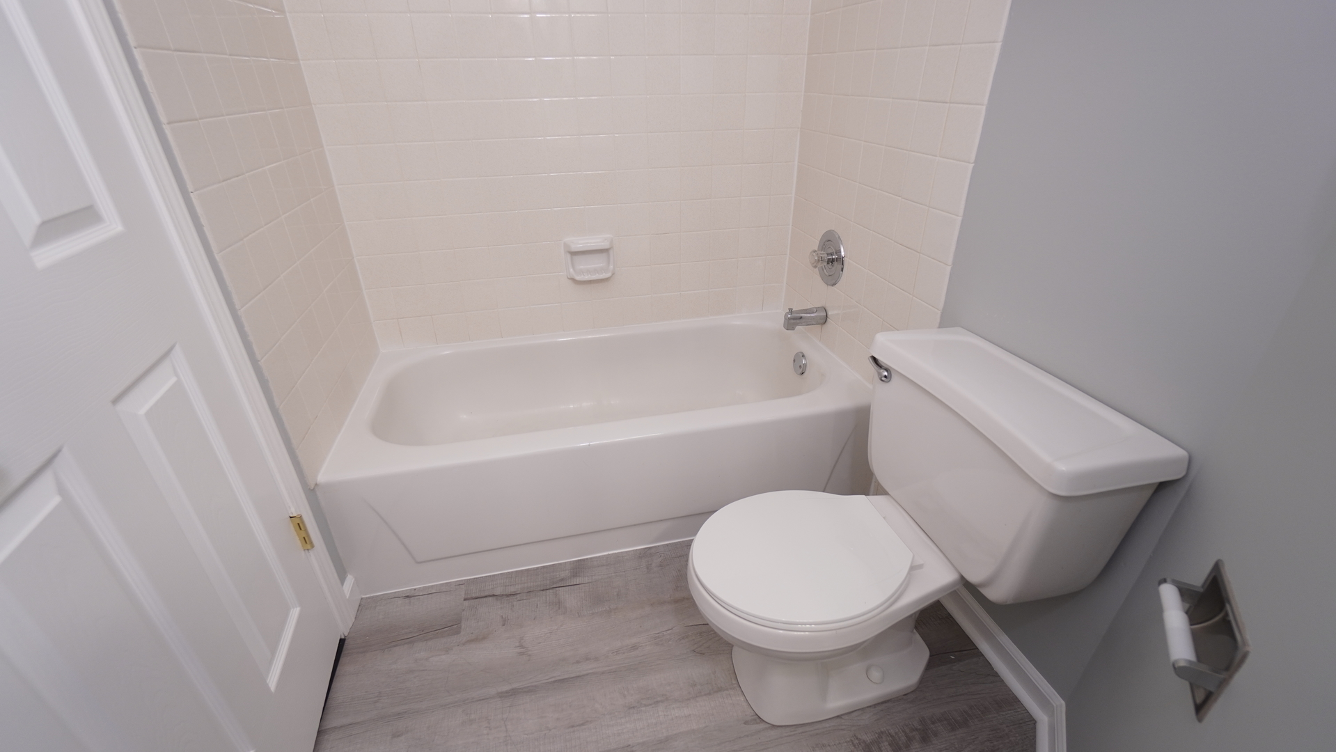 123 West Willowbrook Court, Unit 3 Schaumburg, IL 60195 - Photo 17 of 25 a white toilet sitting next to a bath tub