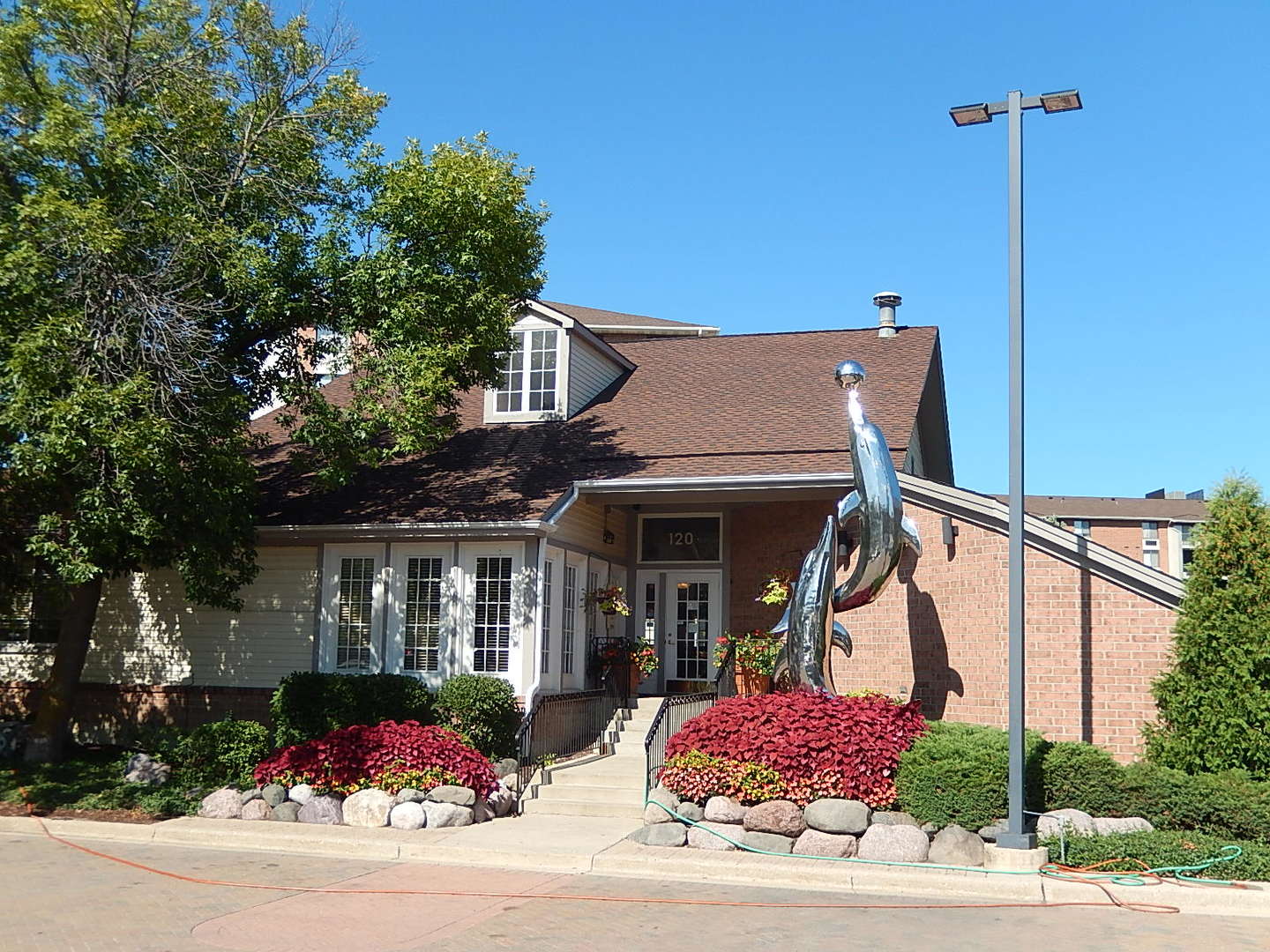 123 West Willowbrook Court, Unit 3 Schaumburg, IL 60195 - Photo 22 of 25 a front view of a house with garden