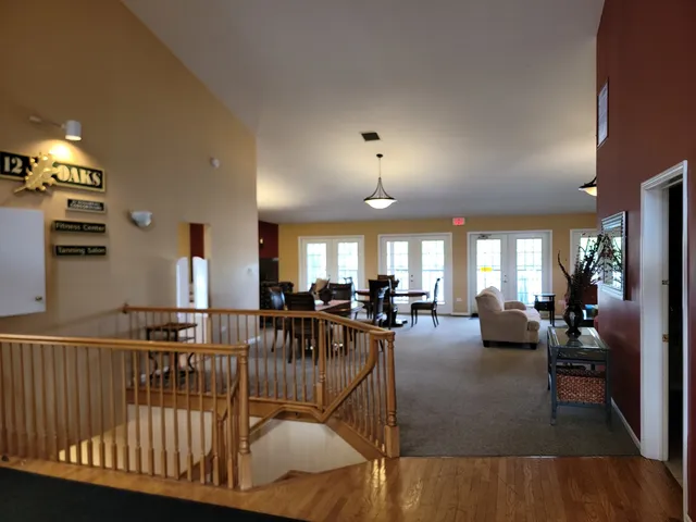a view of a swimming pool with a bench and floor to ceiling window