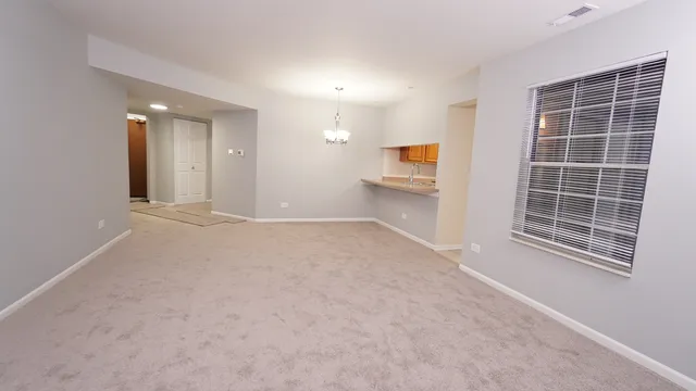 a view of livingroom with furniture and windows