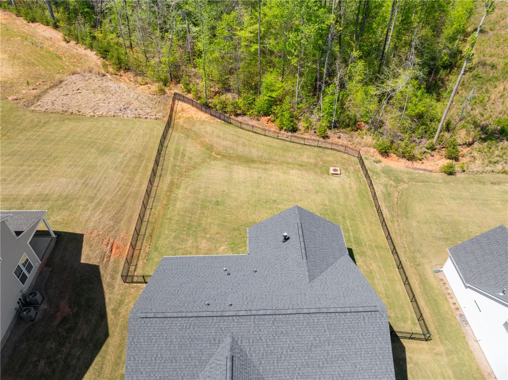 210 Maverick Trail Central, SC 29630 - Photo 37 of 41 This aerial perspective showcases a well-maintained yard, bordered by lush trees and a fence.