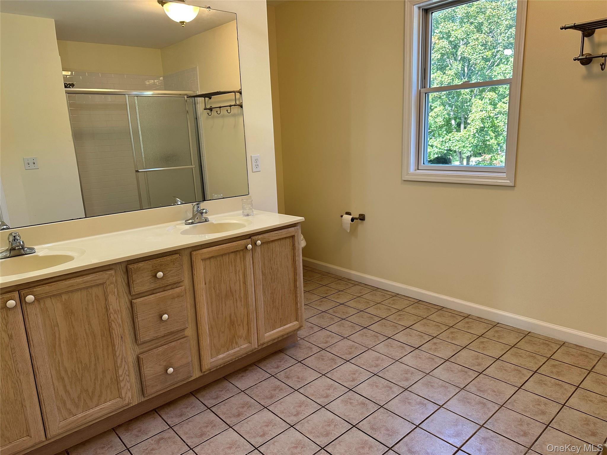 14 Givens Lane Fishkill, NY 12524 - Photo 14 of 20 a spacious bathroom with a double vanity sink mirror and a shower