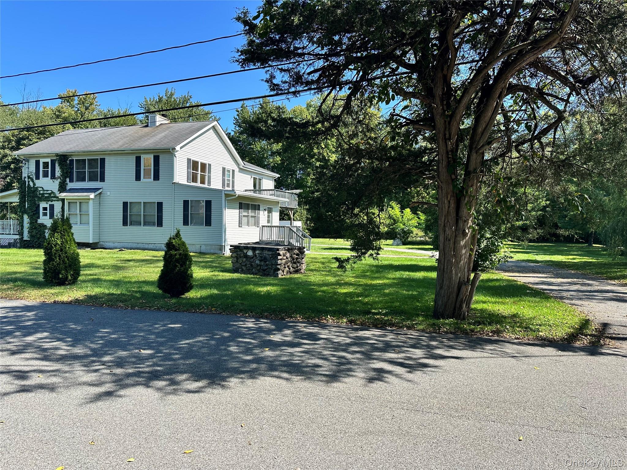14 Givens Lane Fishkill, NY 12524 - Photo 20 of 20 a front view of a house with a garden