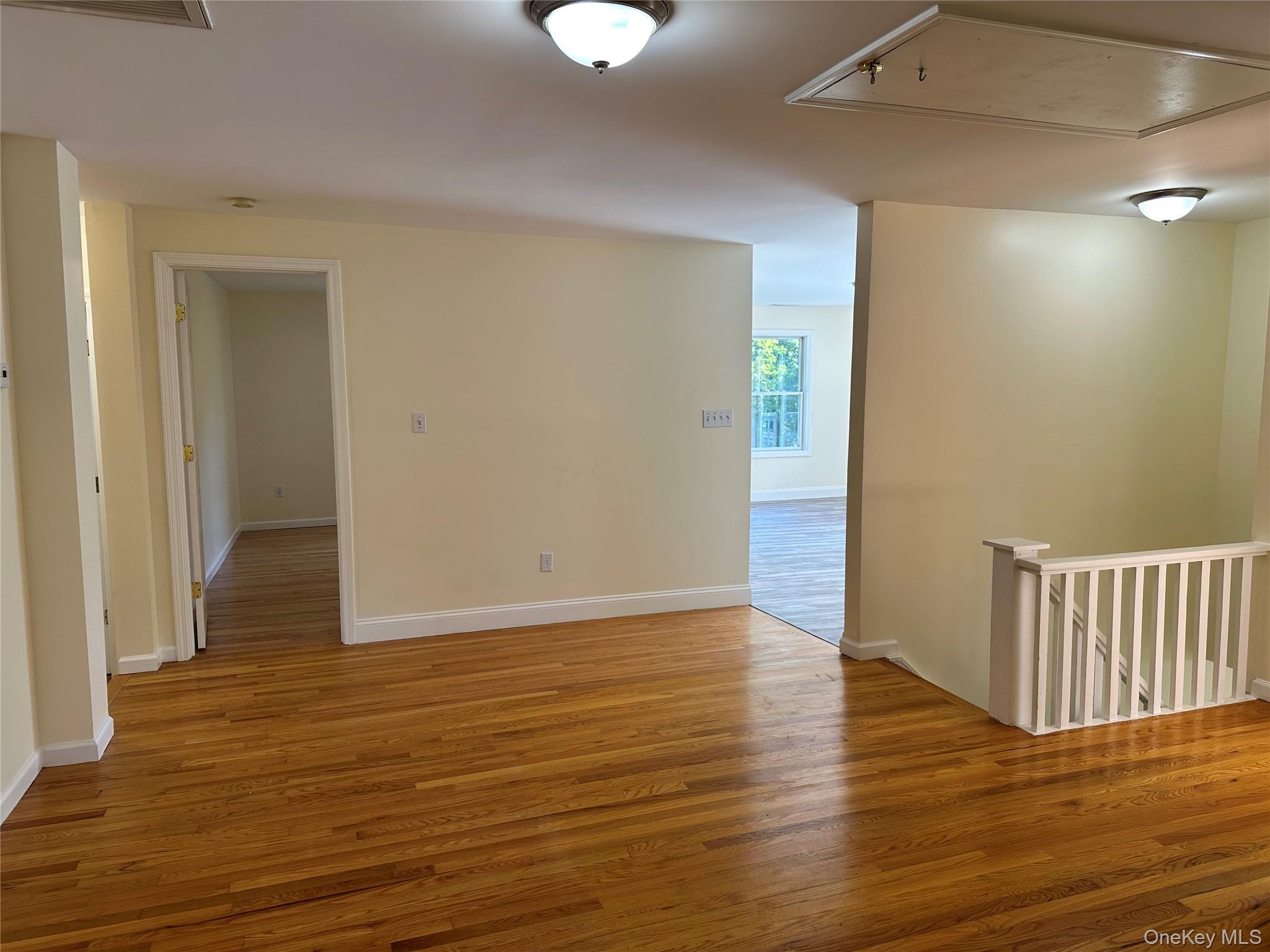 14 Givens Lane Fishkill, NY 12524 - Photo 10 of 20 a view of an empty room with wooden floor and a window