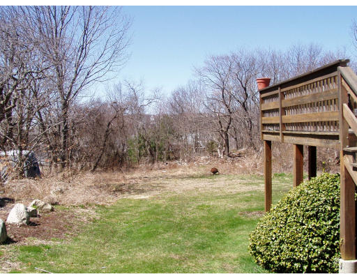 14 Decatur Street Gloucester, MA 01930 - Photo 4 of 6 a backyard of a house with lots of green space