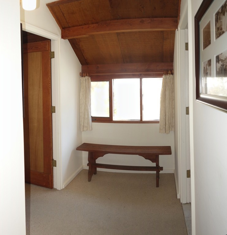 53 Pine Grove, Unit 53 Amherst, MA 01002 - Photo 11 of 24 a room with a window and a chair