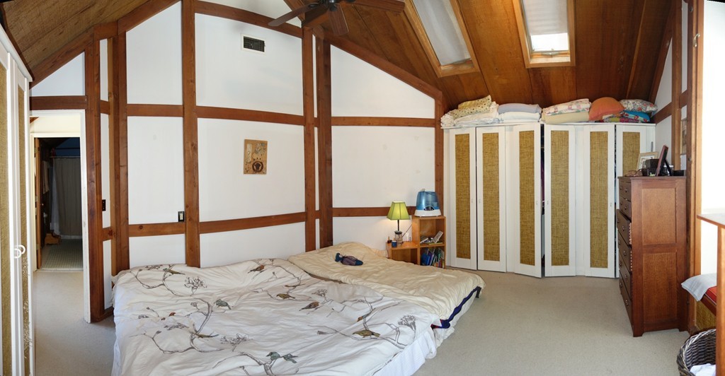 53 Pine Grove, Unit 53 Amherst, MA 01002 - Photo 12 of 24 a bedroom with a bed and a large window