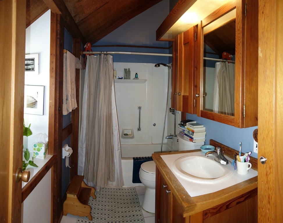 53 Pine Grove, Unit 53 Amherst, MA 01002 - Photo 15 of 24 a bathroom with a sink and a mirror