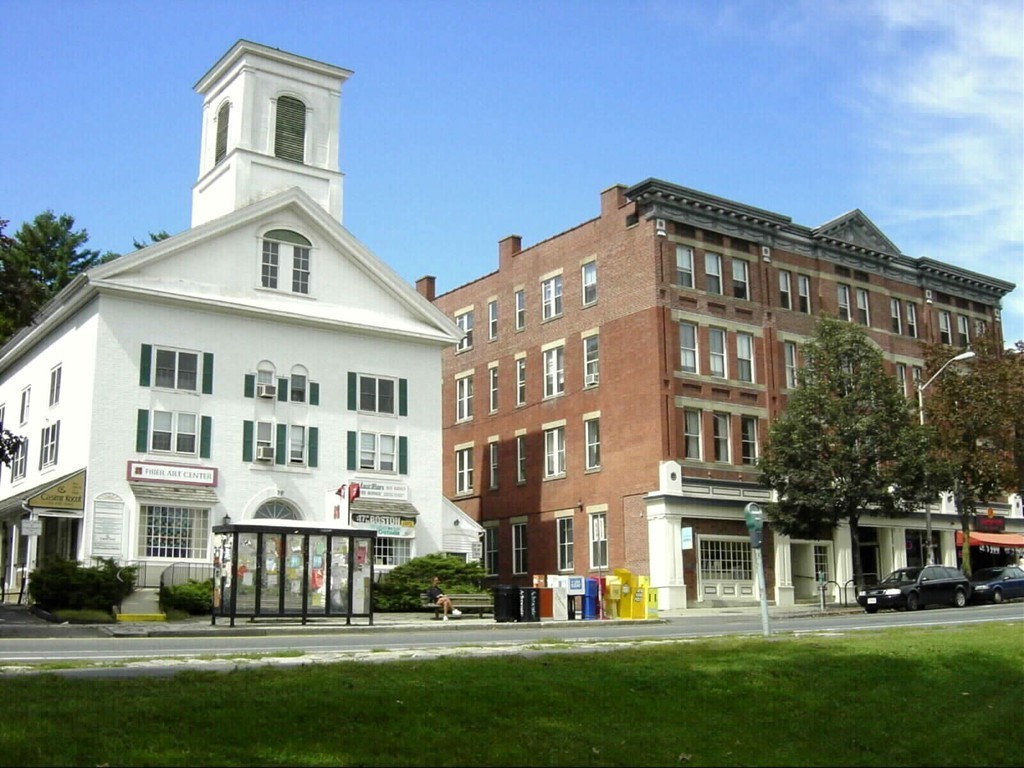 53 Pine Grove, Unit 53 Amherst, MA 01002 - Photo 22 of 24 a front view of a residential apartment building with a yard