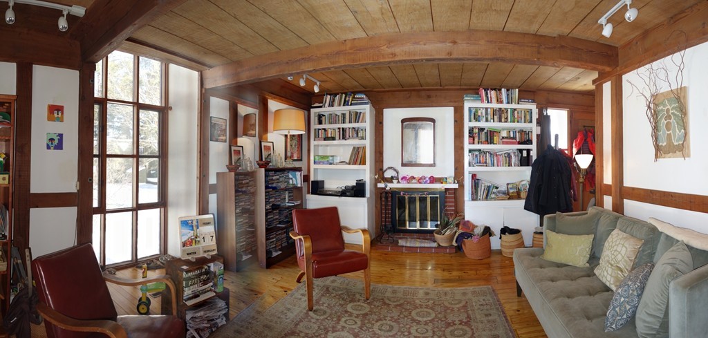 53 Pine Grove, Unit 53 Amherst, MA 01002 - Photo 4 of 24 a living room with furniture a large window and wooden floor