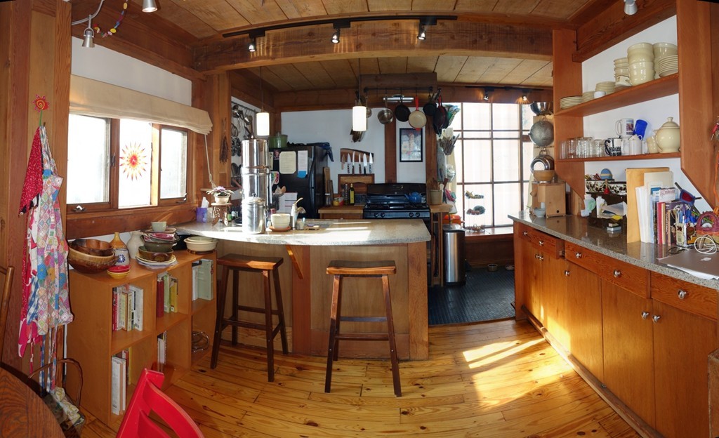 53 Pine Grove, Unit 53 Amherst, MA 01002 - Photo 6 of 24 a kitchen with stainless steel appliances granite countertop a stove a sink dishwasher and cabinets with wooden floor
