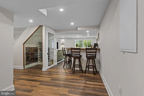 a view of house with deck and outdoor seating