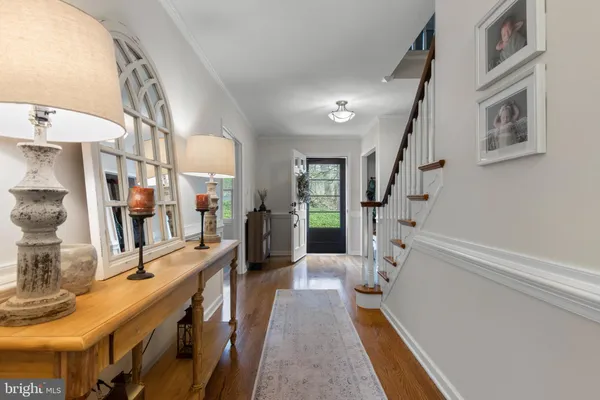 a view of a dining room with furniture kitchen and chandelier