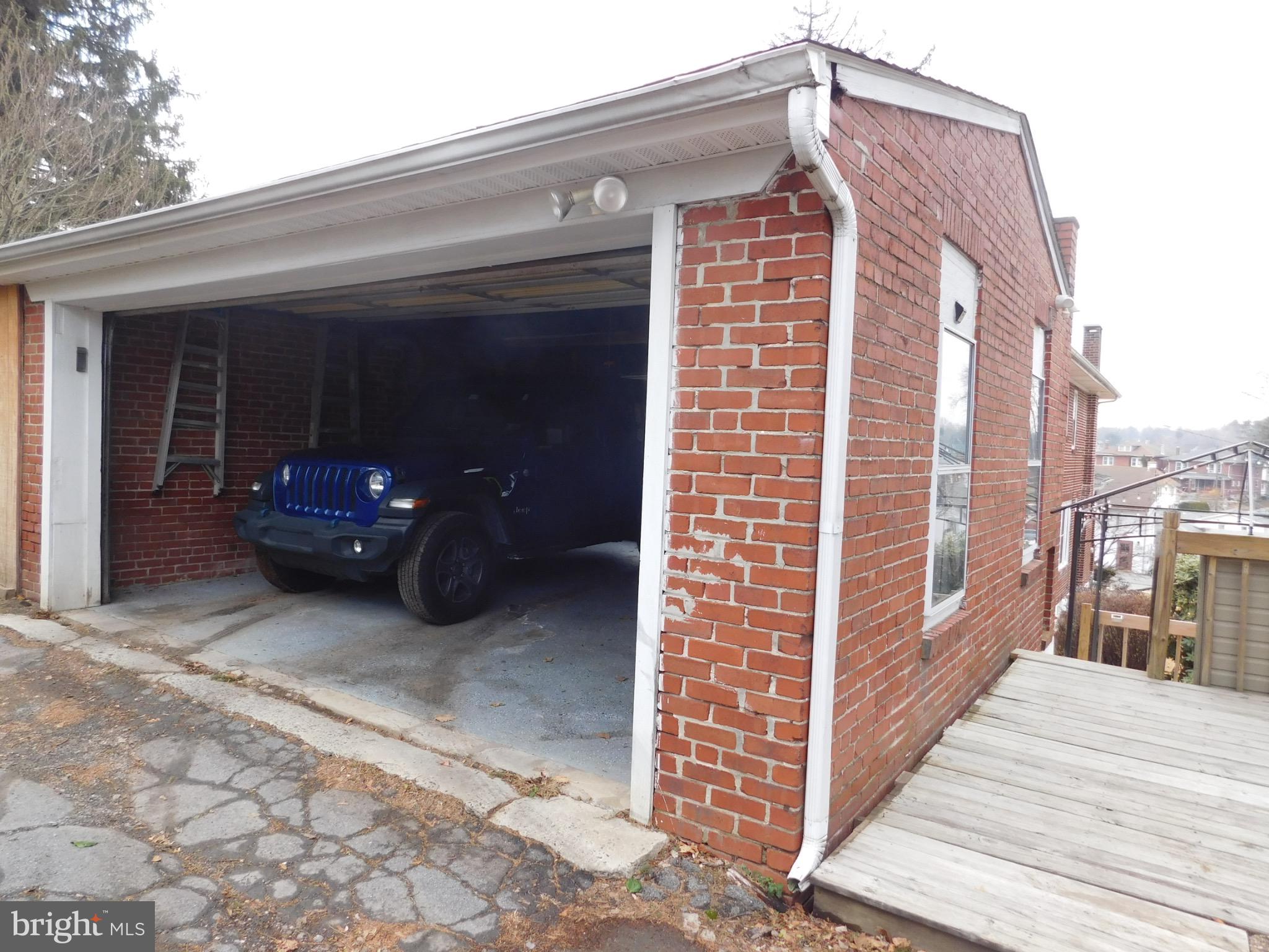 964 New Holland Road Reading, PA 19607 - Photo 48 of 59 Charming brick garage with modern vehicle.